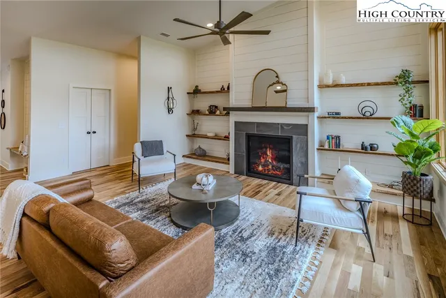 a kitchen with stainless steel appliances granite countertop a refrigerator stove and sink