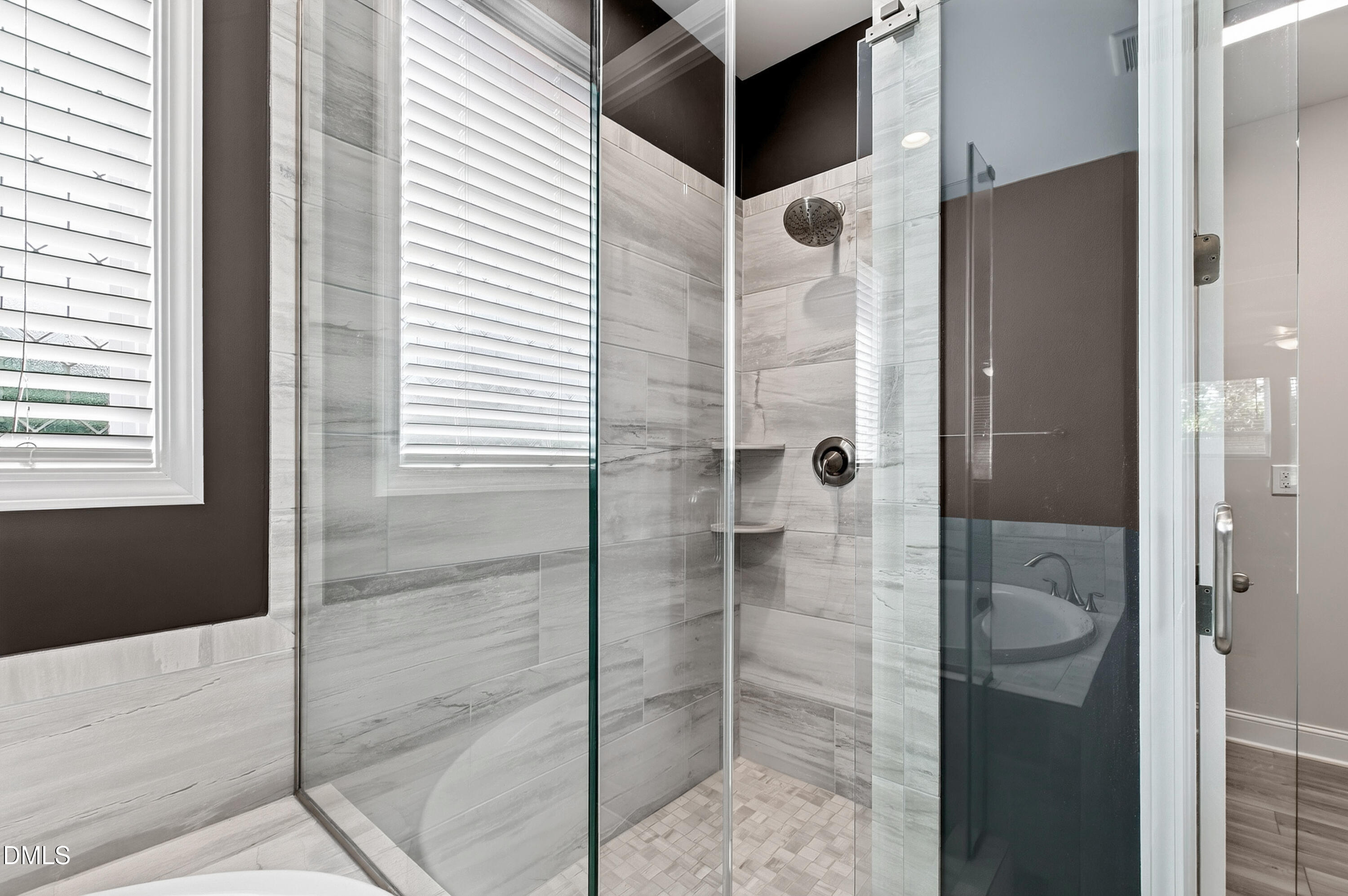1300 Commons Ford Place Apex, NC 27539 - Photo 33 of 70 a bathroom with a shower and a glass door