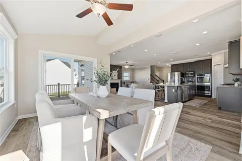a dining room with furniture and window