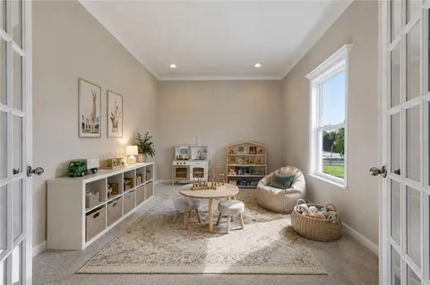 a living room with furniture and a rug
