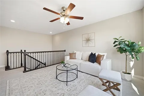a living room with furniture and white walls