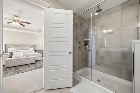 a bathroom with a bathtub and a shower