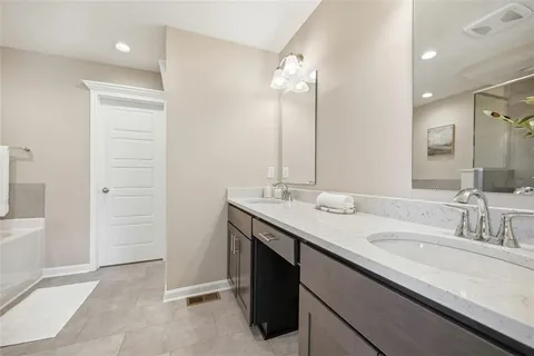 a bathroom with a sink a vanity and a mirror
