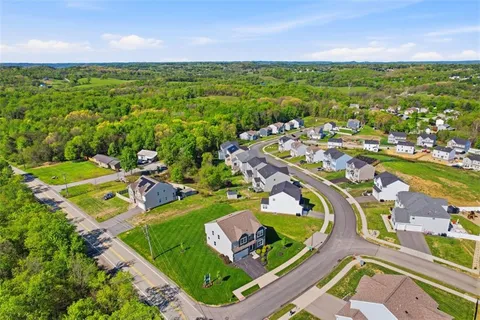 an aerial view of a house with a garden