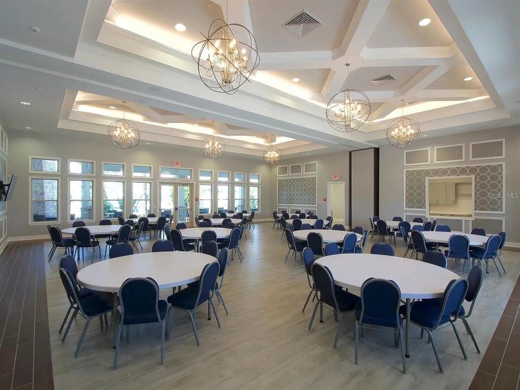 13340 Pontoon Road Winter Garden, FL 34787 - Photo 14 of 15 a view of a dining room with furniture a chandelier and window