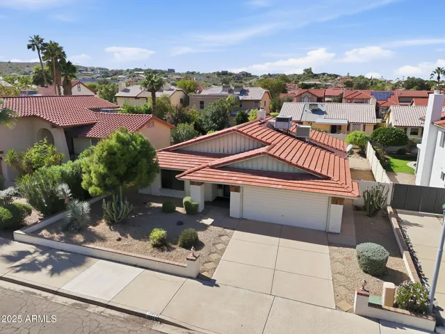 a view of a house with a garden