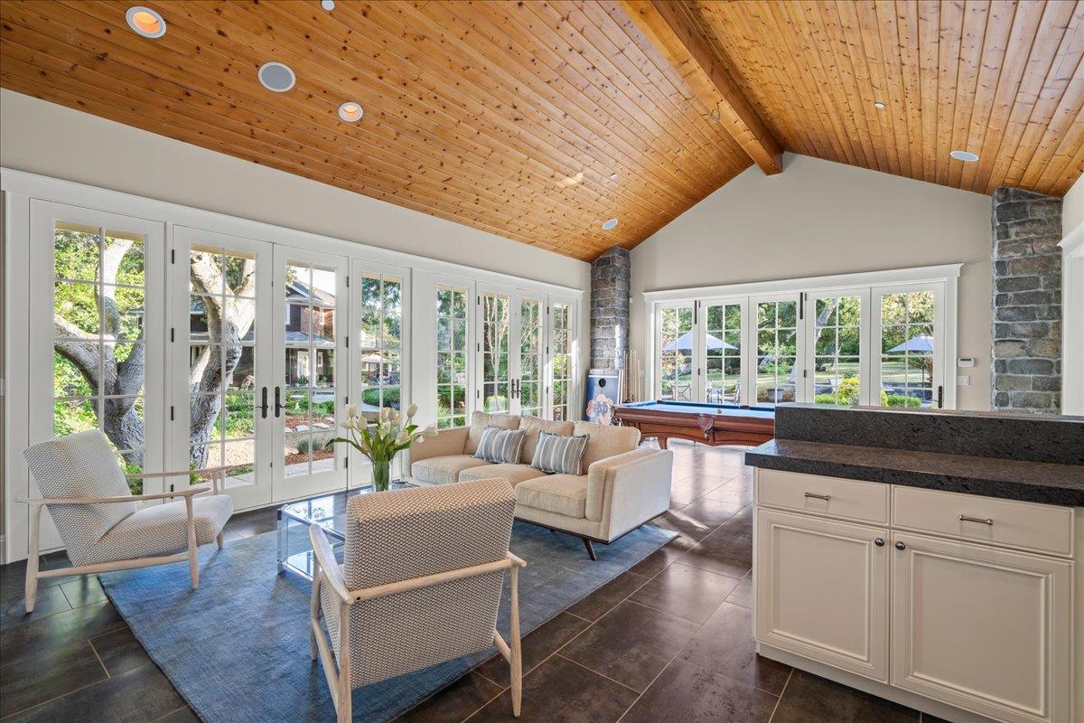 3510 Alpine Road Portola Valley, CA 94028 - Photo 48 of 77 a living room with furniture and large windows