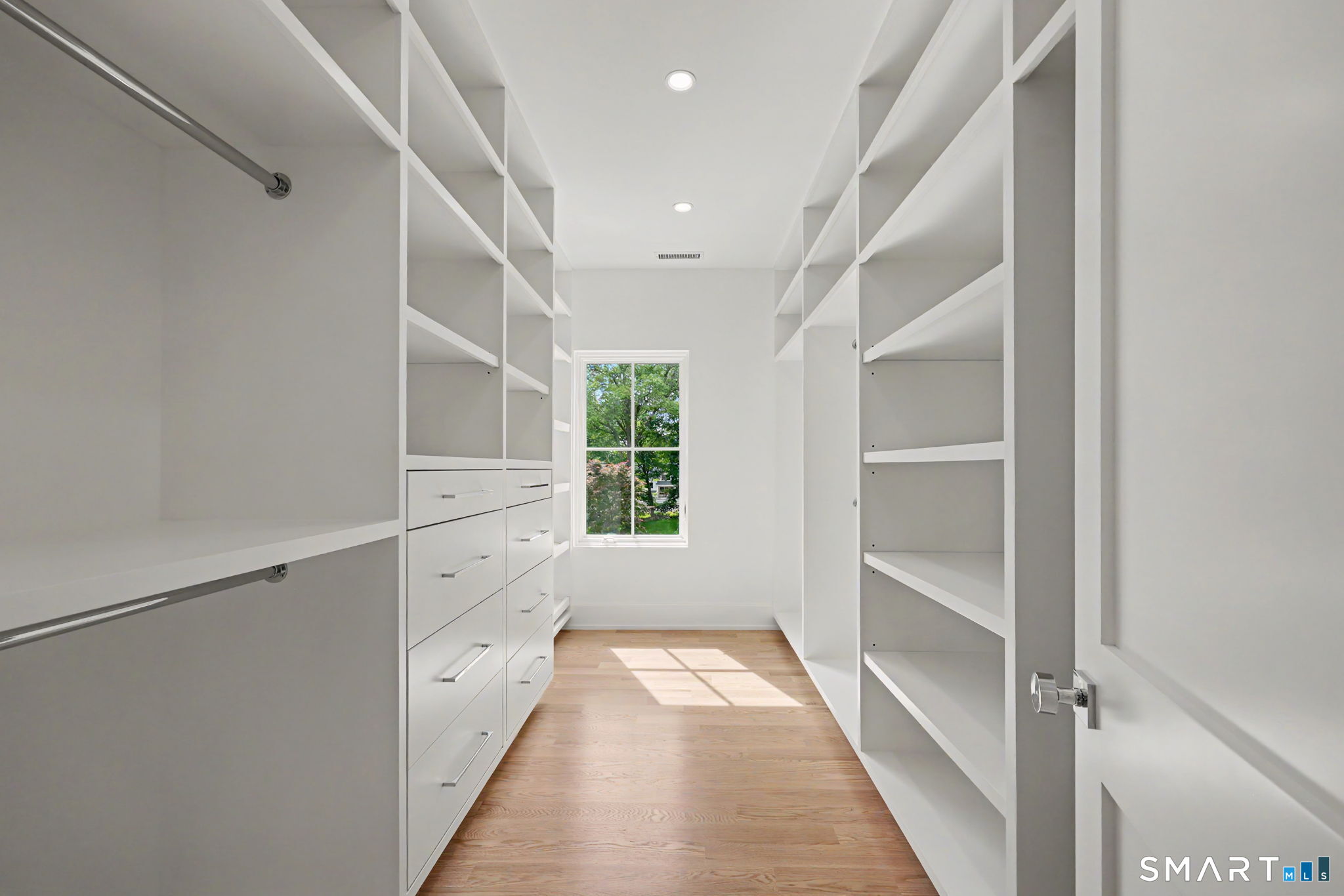 1076 Westover Road Stamford, CT 06902 - Photo 22 of 40 Large walk-in closet with custom built shelves.