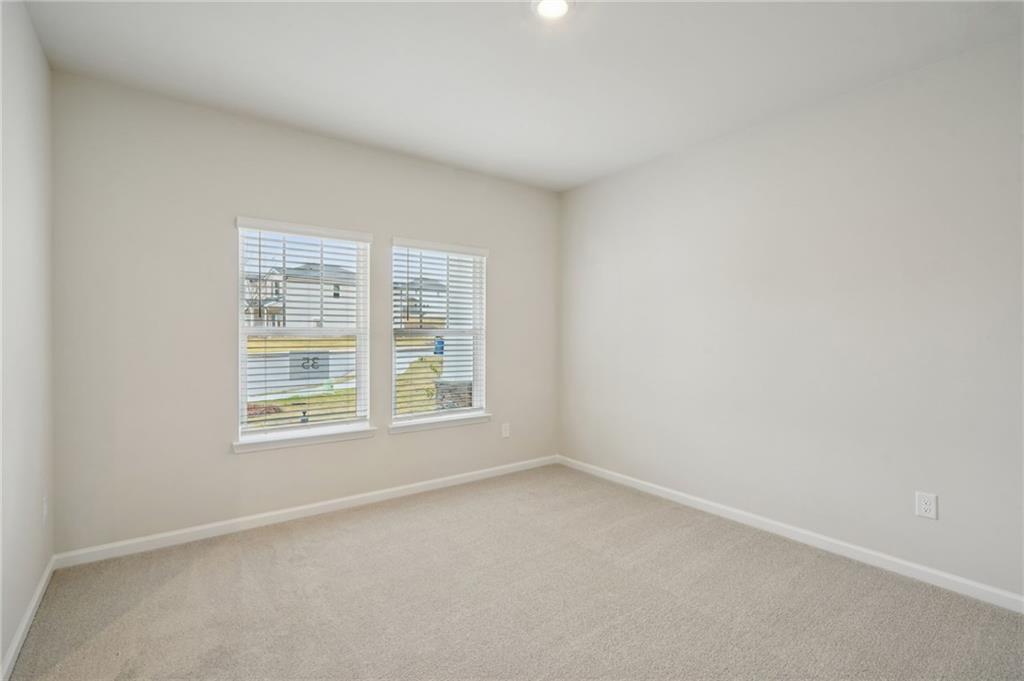 1458 High Fls Lane Grayson, GA 30017 - Photo 16 of 42 an empty room with a window