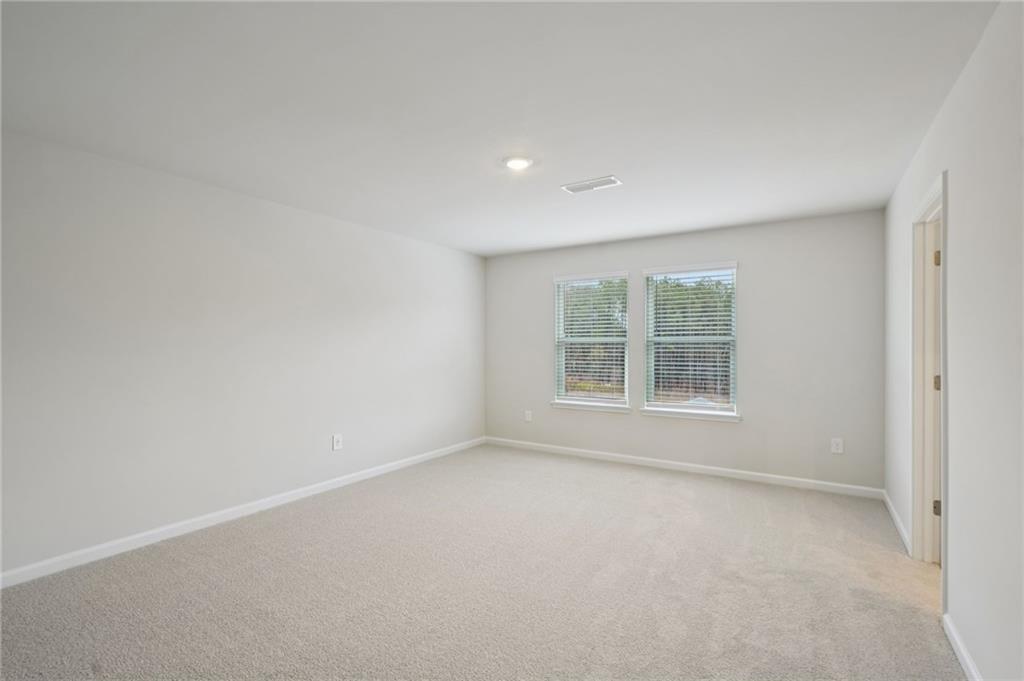 1458 High Fls Lane Grayson, GA 30017 - Photo 24 of 42 an empty room with a window