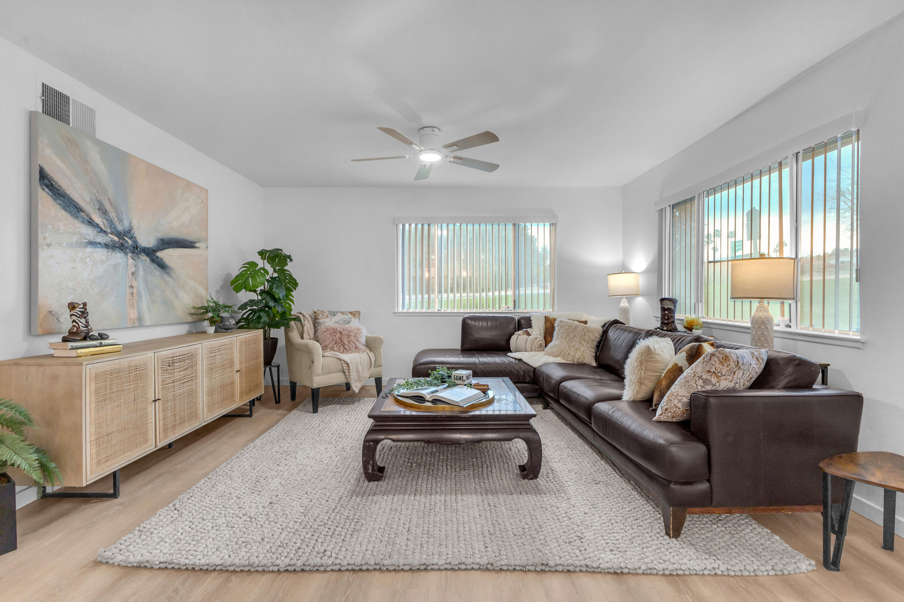 72682 Thrush Road, Unit 1 Palm Desert, CA 92260 - Photo 2 of 40 a living room with furniture and a large window