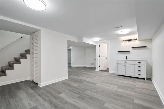 wooden floor and white walls in kitchen