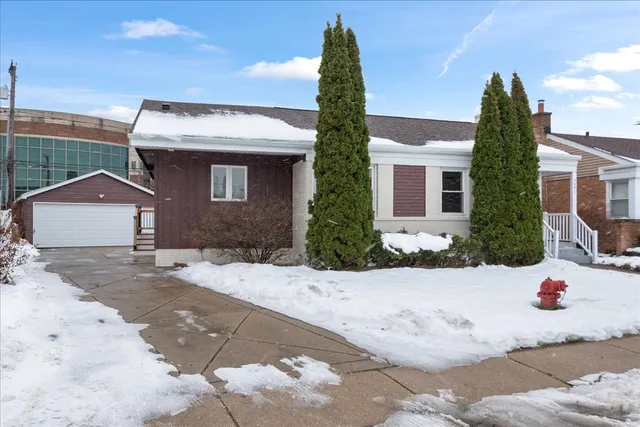 a view of a white house with a outdoor space