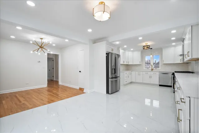 a view of a kitchen with a sink and cabinets