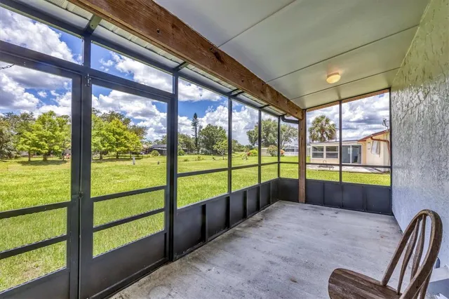 a view of an empty room with a large window