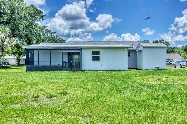 a backyard of a house with lots of green space