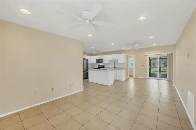 a view of a kitchen with a sink and dishwasher cabinets
