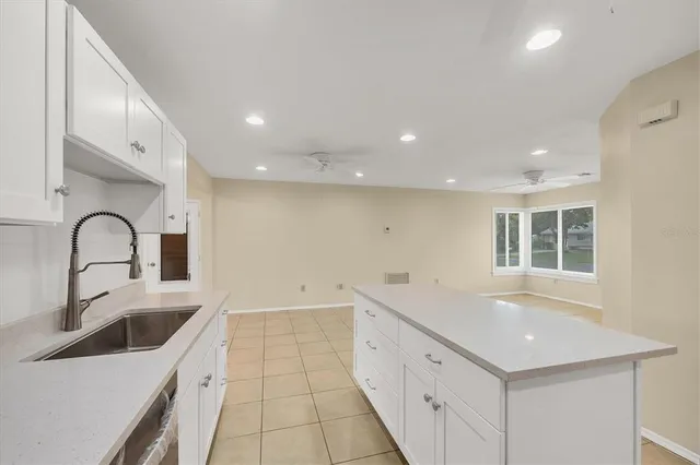a kitchen with a sink and cabinets
