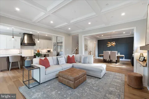 a large bedroom with furniture and a flat screen tv