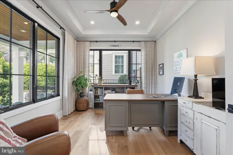 a kitchen with stainless steel appliances granite countertop a sink a stove a refrigerator and a center island