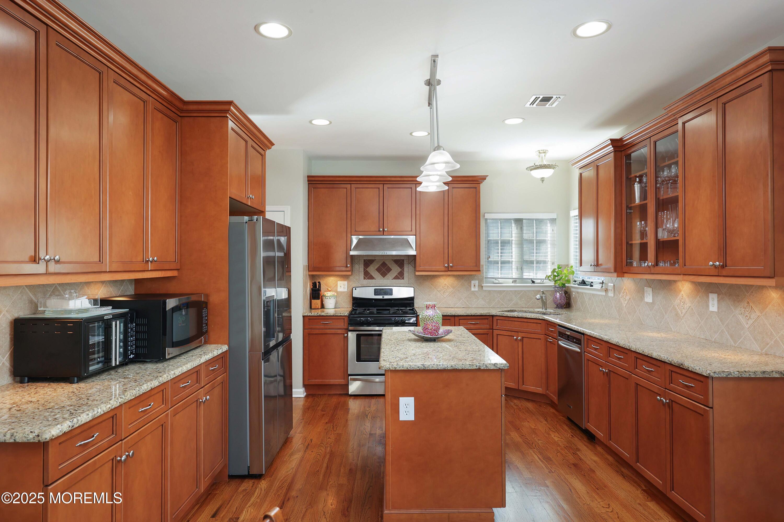 1 Boyd Road Hazlet, NJ 07730 - Photo 14 of 52 a kitchen with stainless steel appliances a sink stove and refrigerator