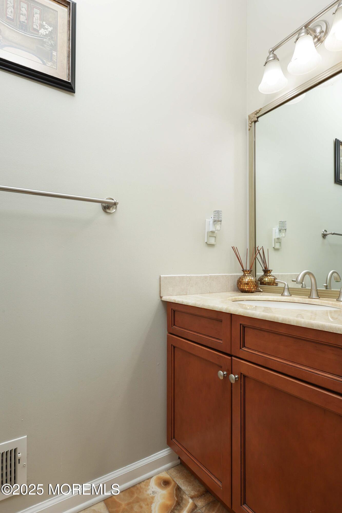 1 Boyd Road Hazlet, NJ 07730 - Photo 19 of 52 a bathroom with a sink and a mirror