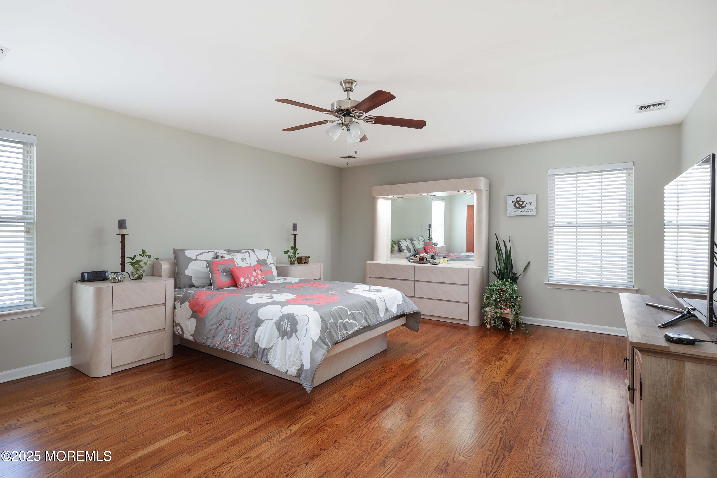 1 Boyd Road Hazlet, NJ 07730 - Photo 22 of 52 a bedroom with a bed and a chandelier