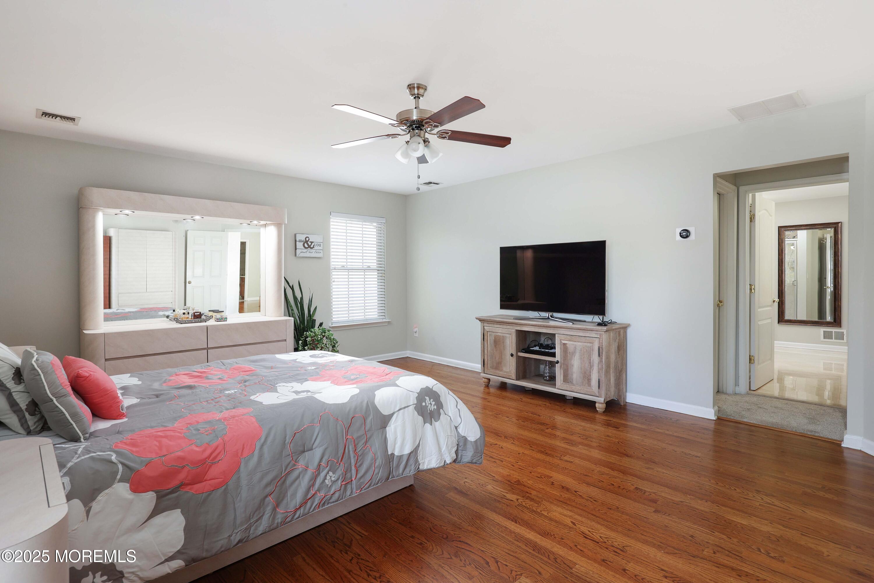 1 Boyd Road Hazlet, NJ 07730 - Photo 23 of 52 a bedroom with a bed and a flat screen tv