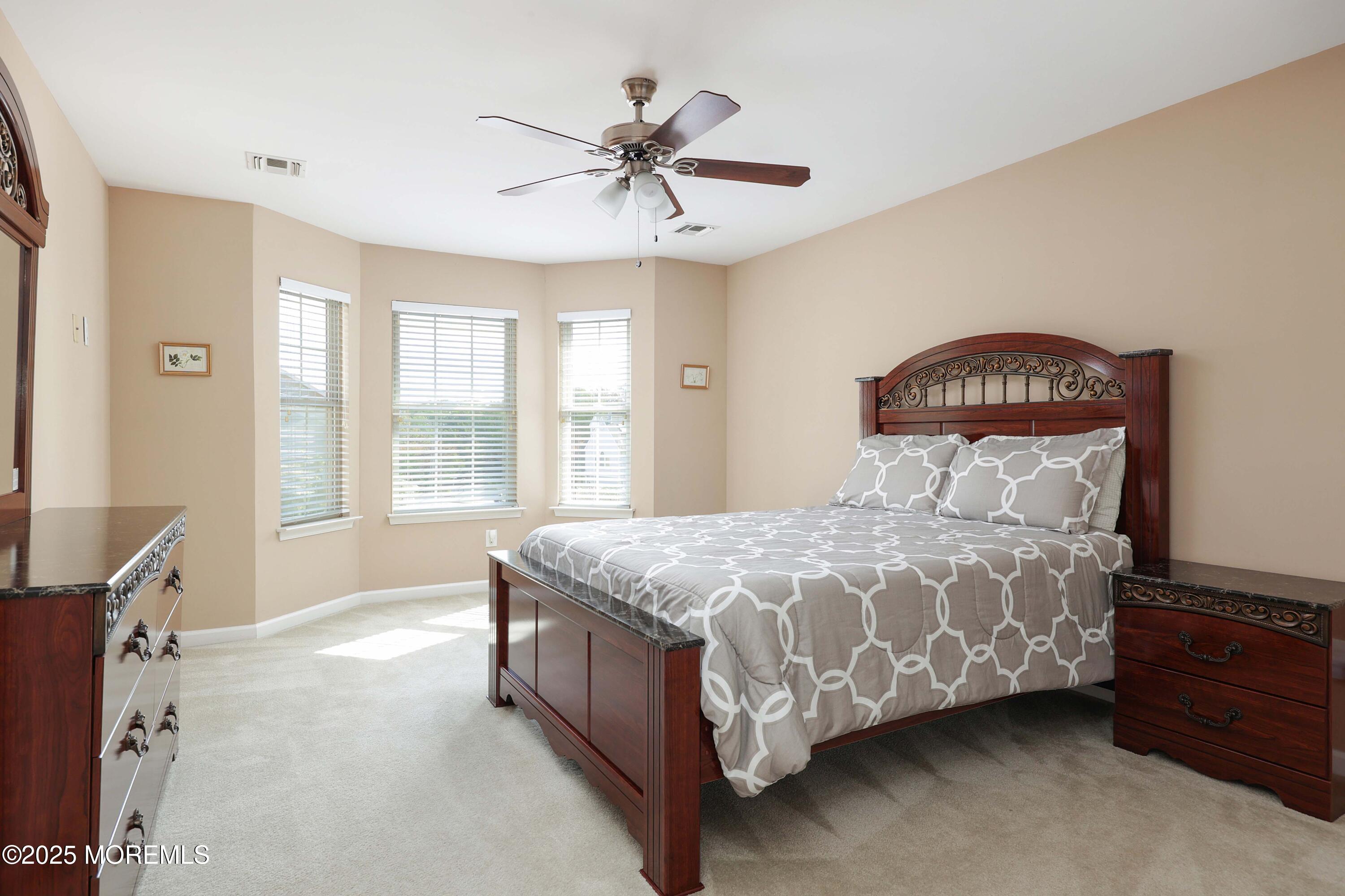 1 Boyd Road Hazlet, NJ 07730 - Photo 28 of 52 a bed sitting in a bedroom next to a window