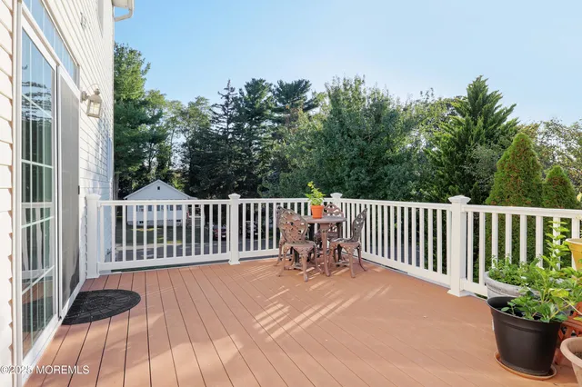 a view of a two chairs on the roof deck