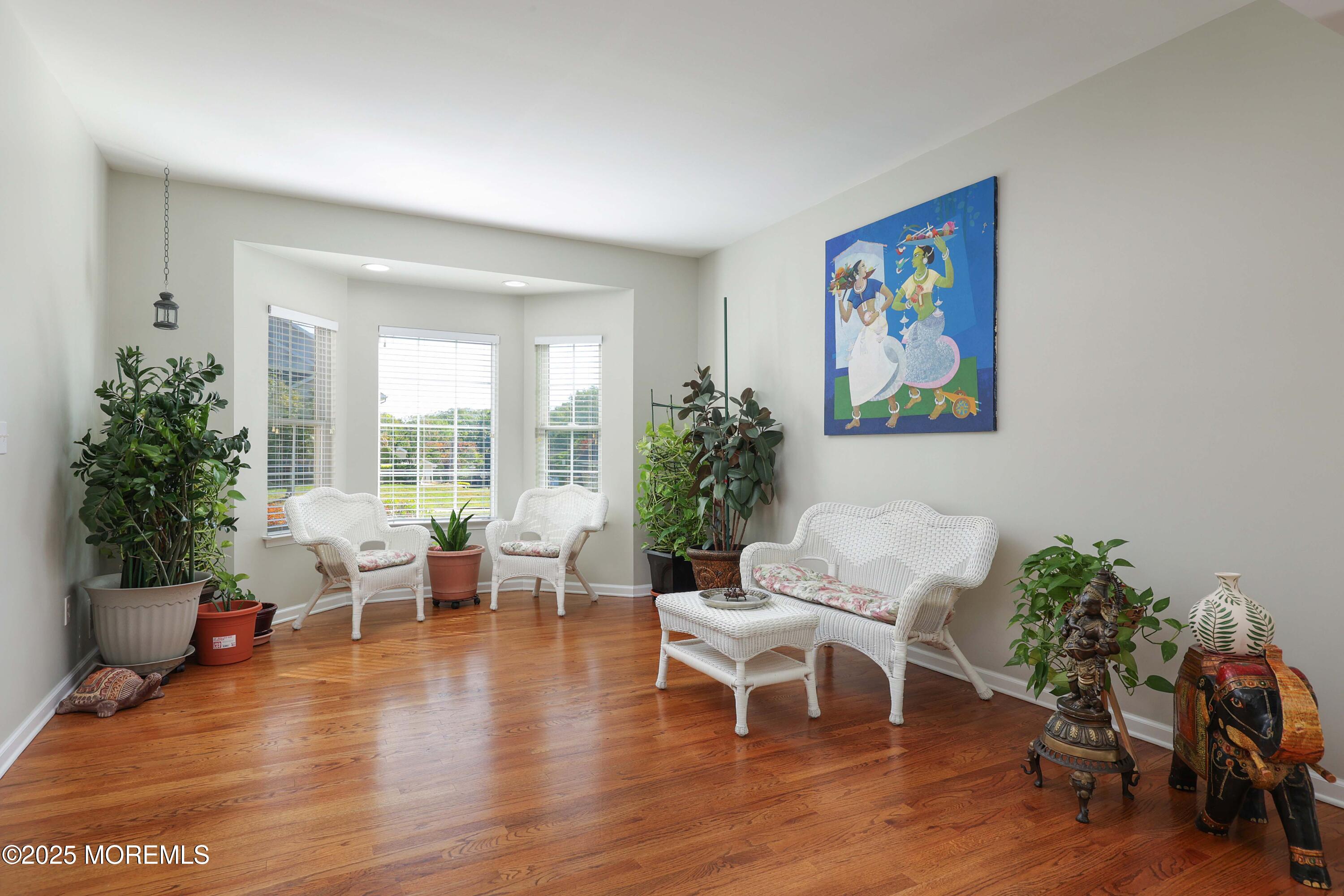 1 Boyd Road Hazlet, NJ 07730 - Photo 9 of 52 a living room with furniture dining table a large window and potted plants