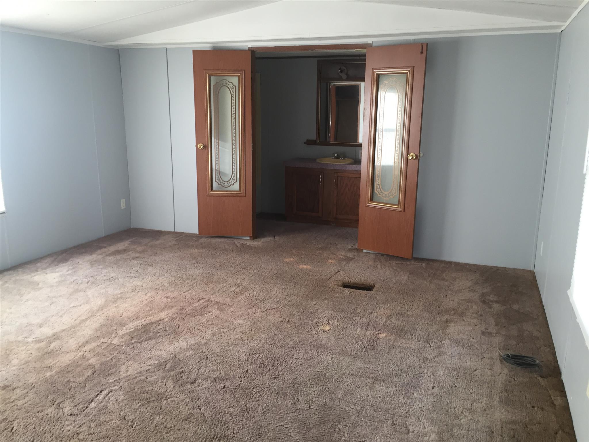 2175 Baggett Road Palmyra, TN 37142 - Photo 11 of 19 a view of an empty room with closet and a window