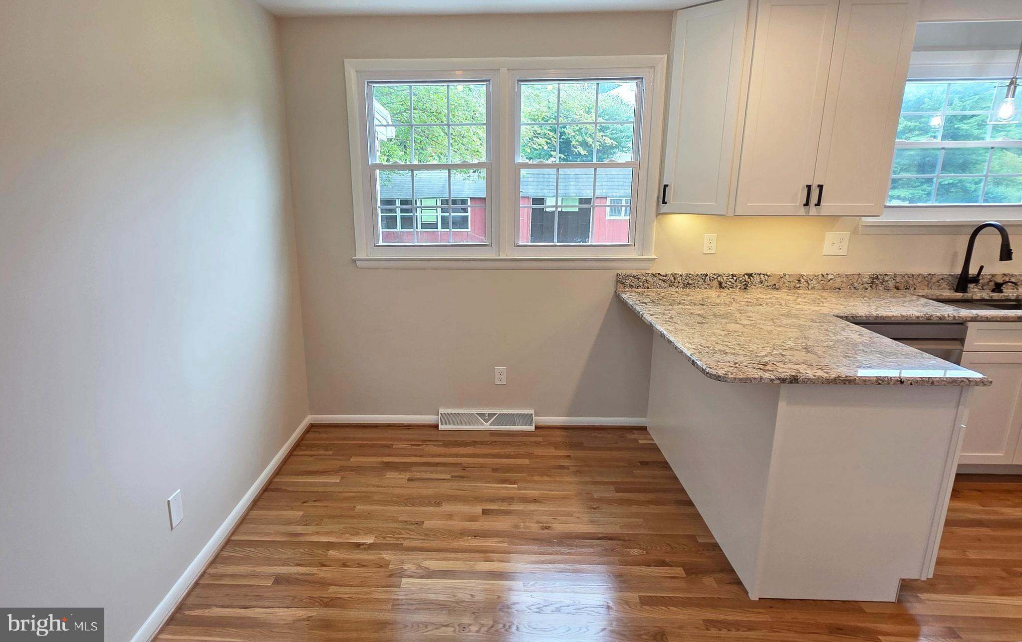 1900 Shetland Road Finksburg, MD 21048 - Photo 12 of 32 a view of a kitchen with wooden floor and a sink