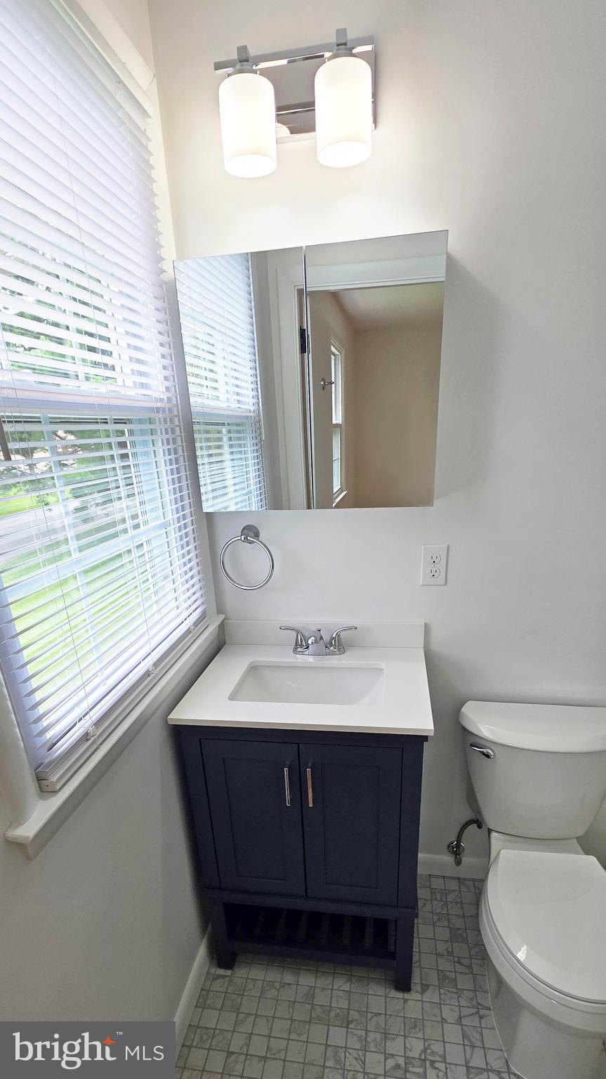 1900 Shetland Road Finksburg, MD 21048 - Photo 21 of 32 a bathroom with a toilet sink and mirror