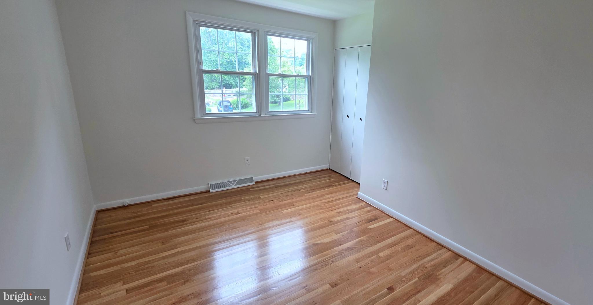 1900 Shetland Road Finksburg, MD 21048 - Photo 23 of 32 an empty room with wooden floor and windows