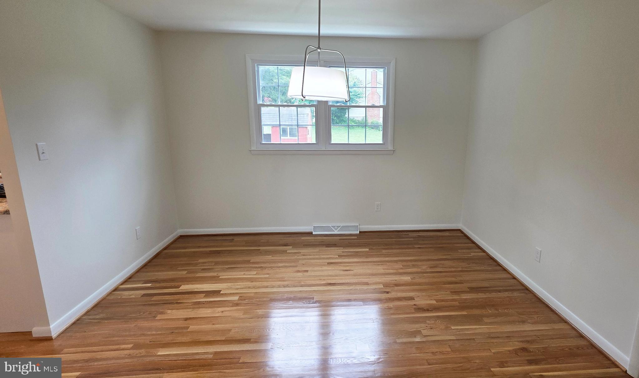 1900 Shetland Road Finksburg, MD 21048 - Photo 6 of 32 a view of empty room with wooden floor and fan