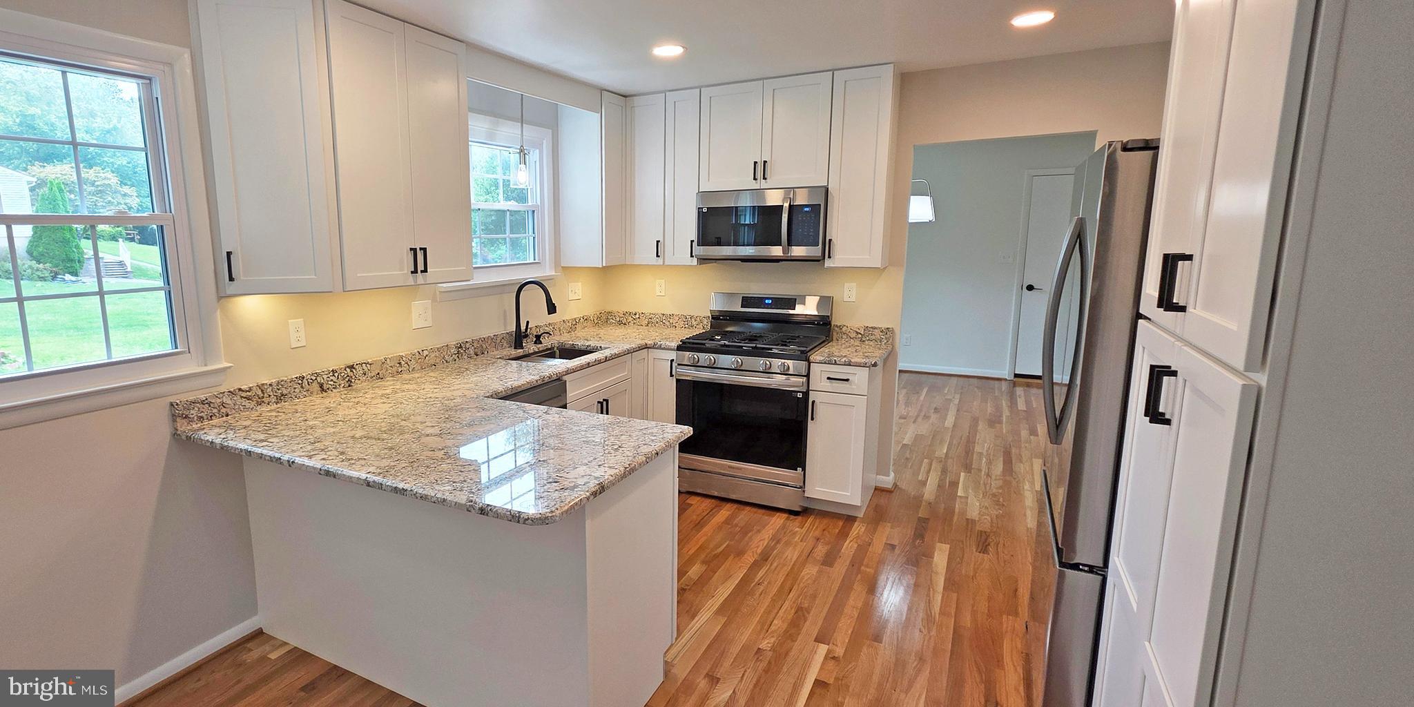 1900 Shetland Road Finksburg, MD 21048 - Photo 8 of 32 a kitchen with stainless steel appliances granite countertop a refrigerator a stove top oven a sink and dishwasher