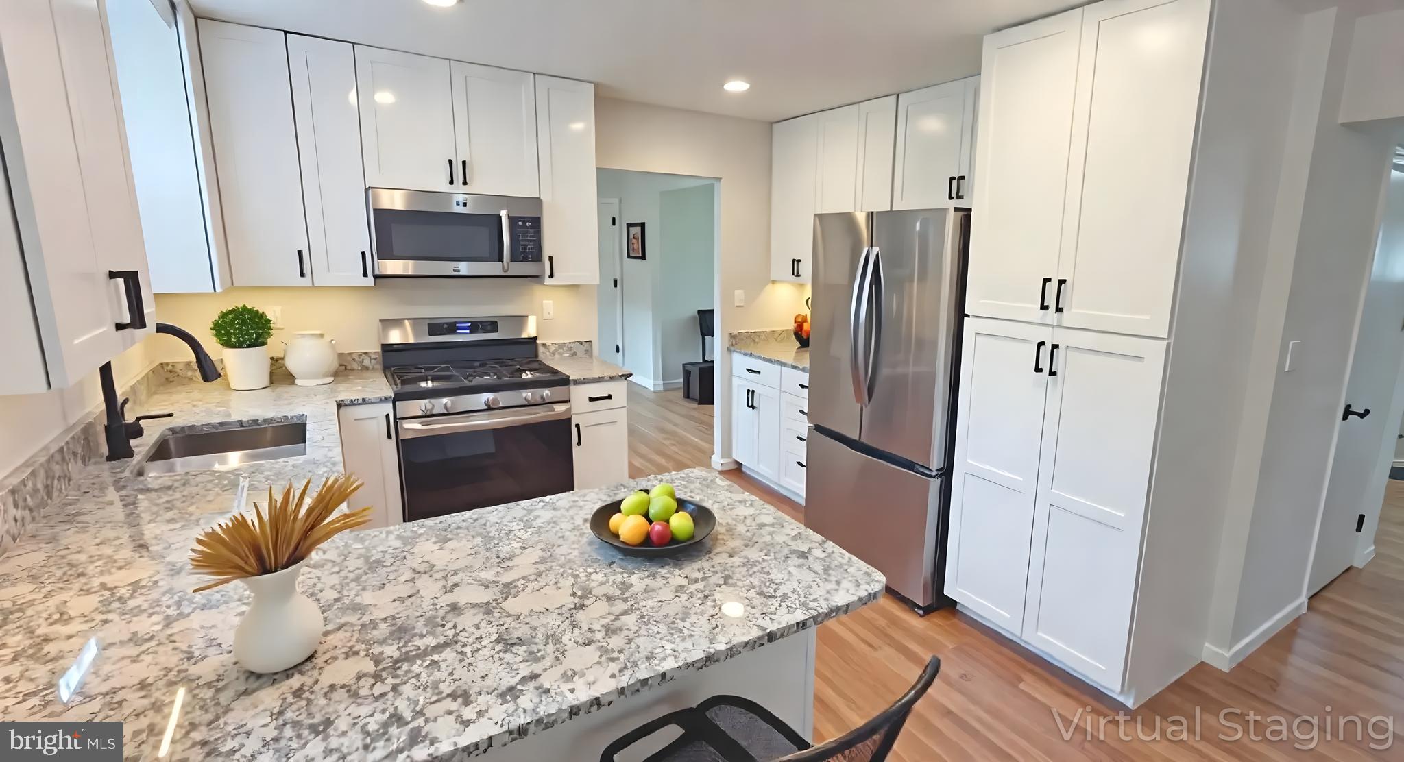 1900 Shetland Road Finksburg, MD 21048 - Photo 9 of 32 a kitchen with a refrigerator a stove a microwave a sink and a counter