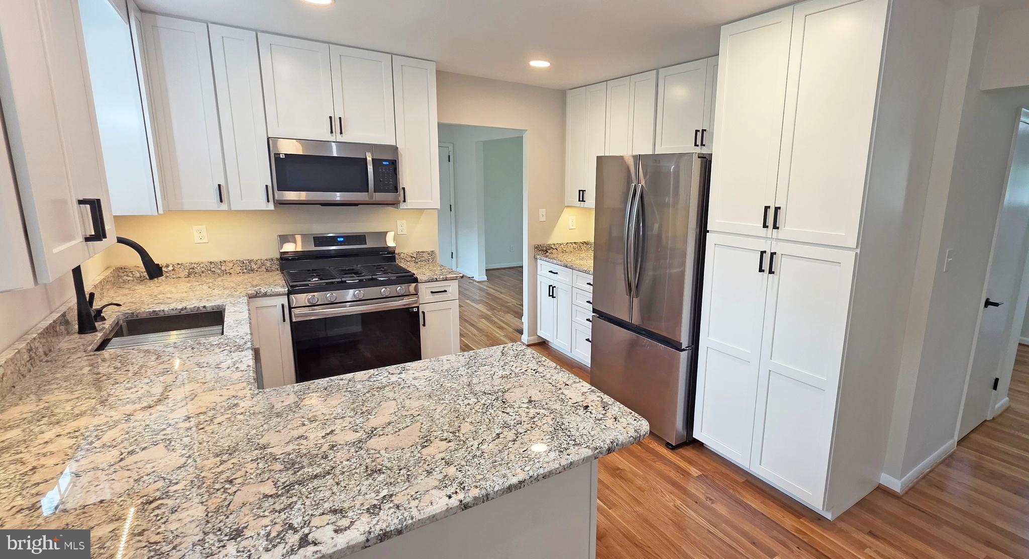 1900 Shetland Road Finksburg, MD 21048 - Photo 10 of 32 a kitchen with stainless steel appliances granite countertop a refrigerator stove and microwave