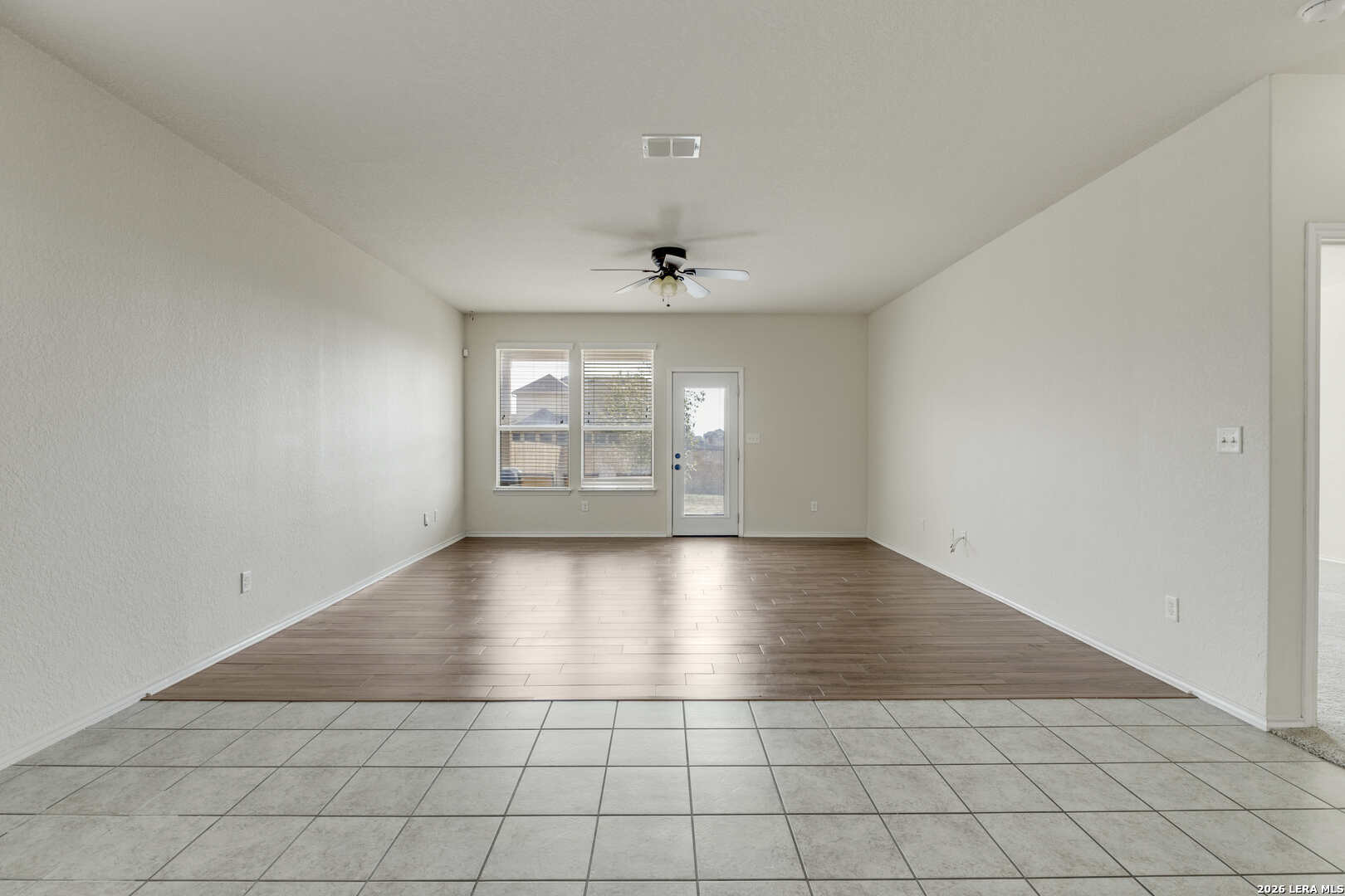 322 Walnut Crest Selma, TX 78154 - Photo 14 of 33 an empty room with windows and ceiling fan
