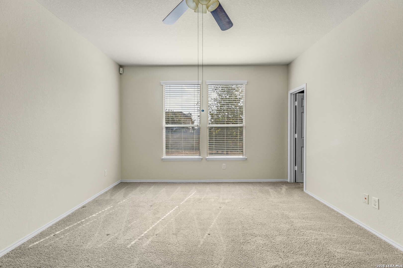 322 Walnut Crest Selma, TX 78154 - Photo 19 of 33 an empty room with windows and fan