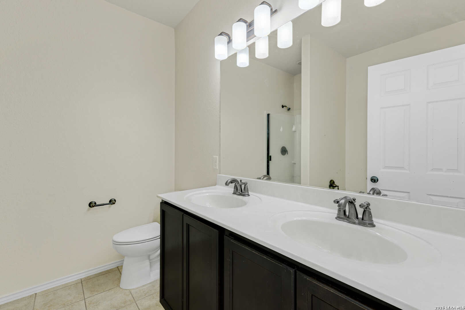 322 Walnut Crest Selma, TX 78154 - Photo 21 of 33 a bathroom with a sink a toilet and a large mirror