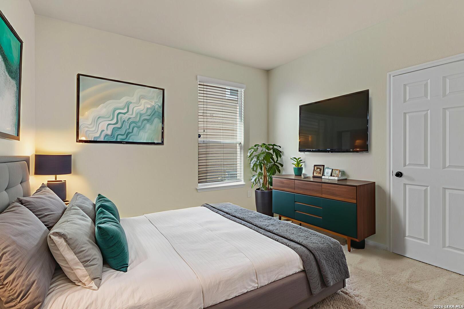 322 Walnut Crest Selma, TX 78154 - Photo 24 of 33 a bedroom with a bed and a flat screen tv