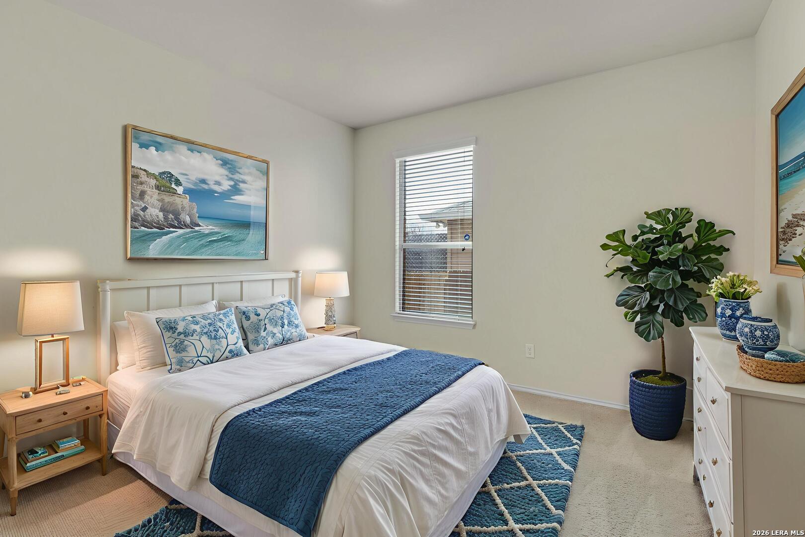 322 Walnut Crest Selma, TX 78154 - Photo 27 of 33 a bedroom with a large bed and a potted plant