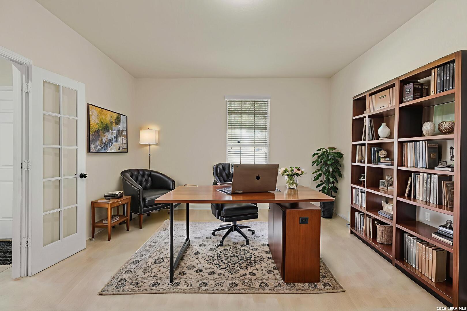 322 Walnut Crest Selma, TX 78154 - Photo 6 of 33 a view of a workspace with furniture and a bookshelf