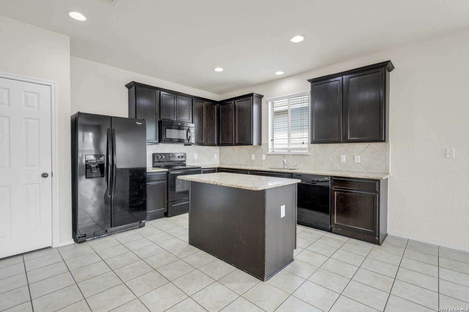 322 Walnut Crest Selma, TX 78154 - Photo 9 of 33 a kitchen with stainless steel appliances granite countertop a refrigerator and a stove top oven