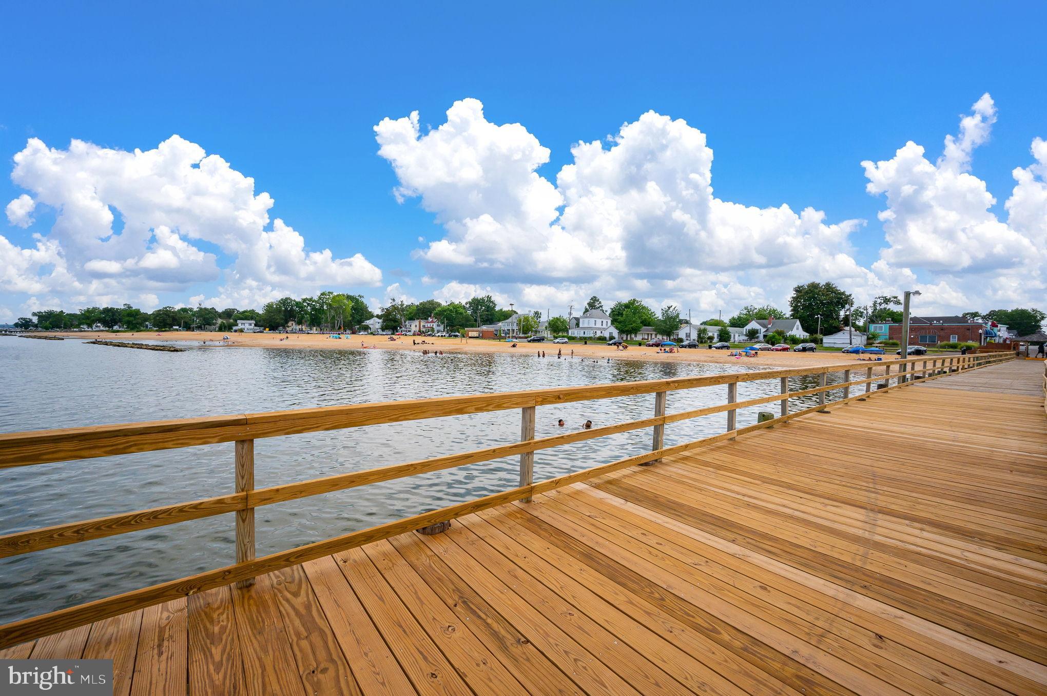 312 9th Street Colonial Beach, VA 22443 - Photo 45 of 62 Serene waterfront stroll under blue skies.