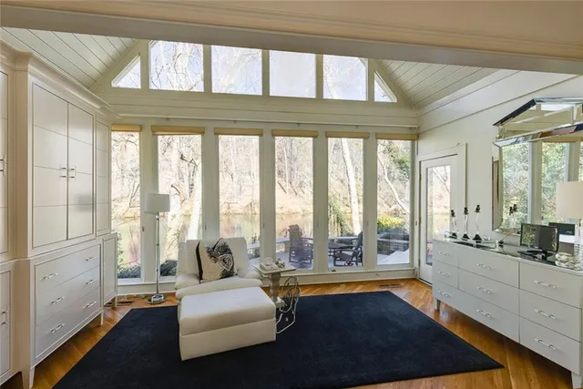 a bathroom with a shower and a glass door