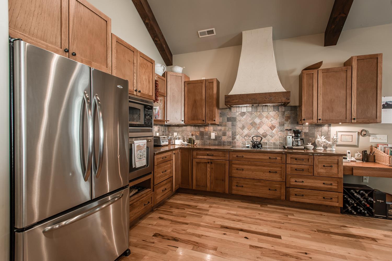 7329 Bahne Road Fairview, TN 37062 - Photo 12 of 30 a kitchen with stainless steel appliances granite countertop a refrigerator sink and stove