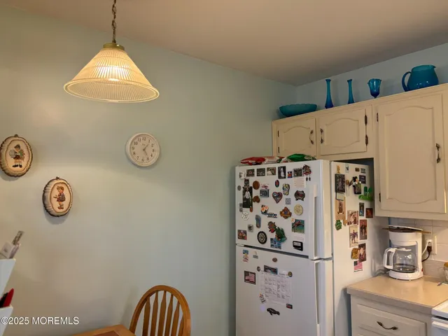 a view of a dining room with furniture and window
